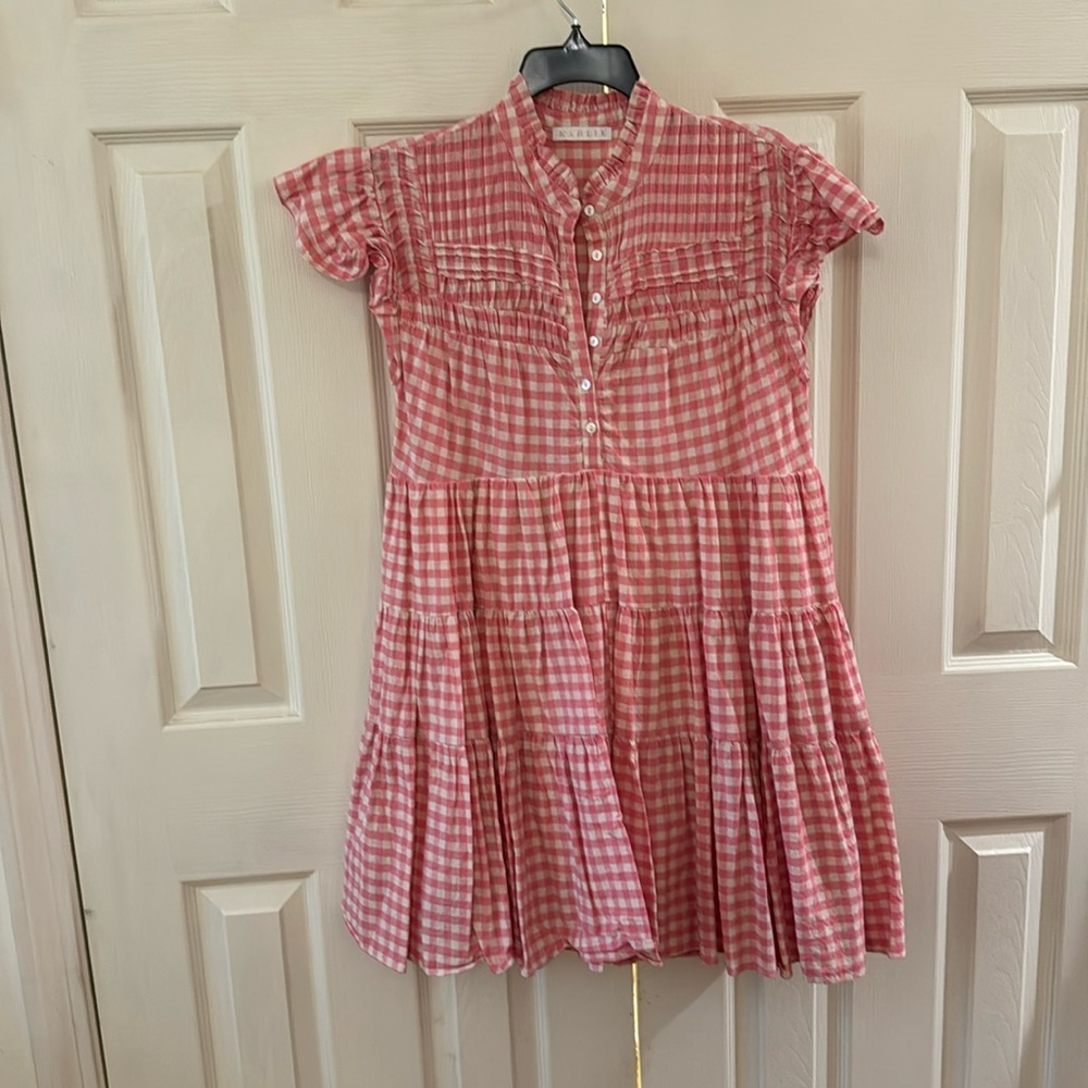 Pink and tan plaid Karlie mini dress. Tiered with button from. size medium.